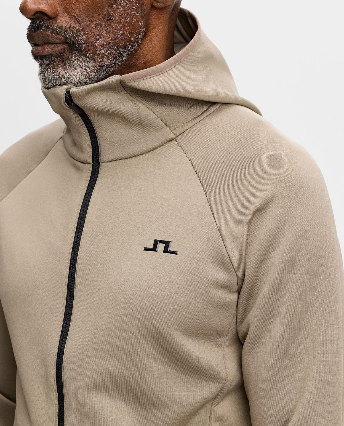 J.Lindeberg Pollock Polartec Hood Men - Brun brindle mellanlager med huva på modell