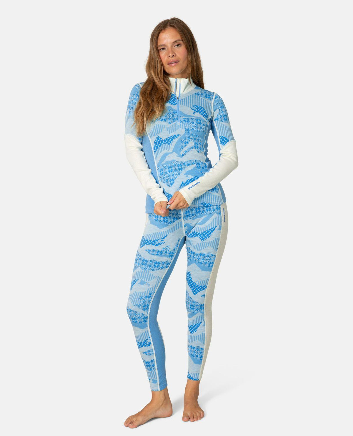 Kari Traa Olea Half Zip i oceanblått med nordiskt mönster och matchande underställsbyxor för dam.