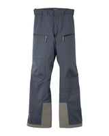 Houdini Ride Pants II dam i färgen blå framifrån, med dragkedjeförsedda fickor och förstärkningar vid bensluten.
