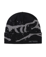 Arc'teryx Grotto Toque mössa i svart och grått för skön värme under kalla dagar i skidbacken.