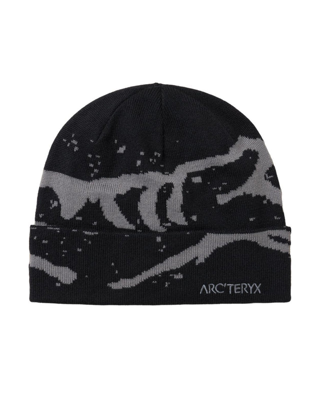 Arc'teryx Grotto Toque mössa i svart och grått för skön värme under kalla dagar i skidbacken.