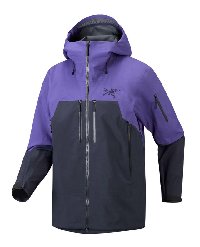 Lila och mörkblå skidjacka från Arc'teryx med huva, dragkedjor och bröstfickor.