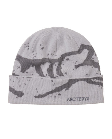Arc'teryx Grotto Toque i grått med bergsmotiv och uppvikbar kant för kalla dagar på berget.