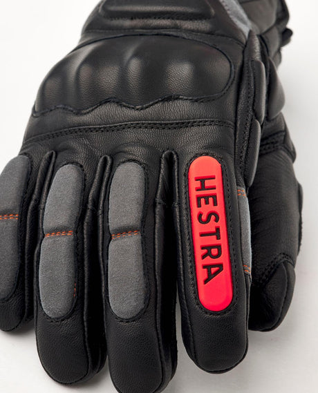 Hestra Impact Racing Sr. 5 Finger - Svart tävlingshandske med knogskydd och flame red-detaljer