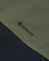 Gore-Tex-logotyp på damernas gröna skidbyxor Peak Performance Alpine Gore-Tex 3L Pants.