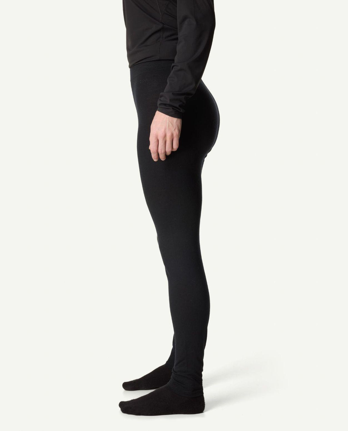 Houdini Puremerino Tights dam i svart sett från sidan.