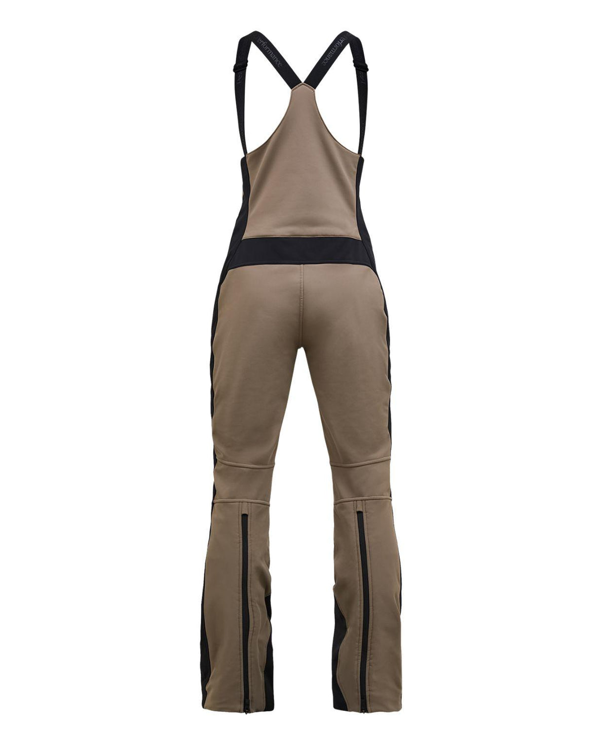Peak Performance Stretch Bib Pants Women i Terrain Tan och Black visas bakifrån med svarta hängslen och dragkedjor.