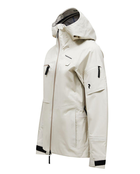 Peak Performance Alpine Gore-Tex 3L damjacka i färgen sand fog visad från sidan.