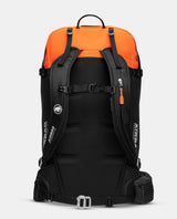 Svart och orange Mammut Tour 40 Removable Airbag 3.0 toppturssäck visad bakifrån med axelremmar och bärsystem.