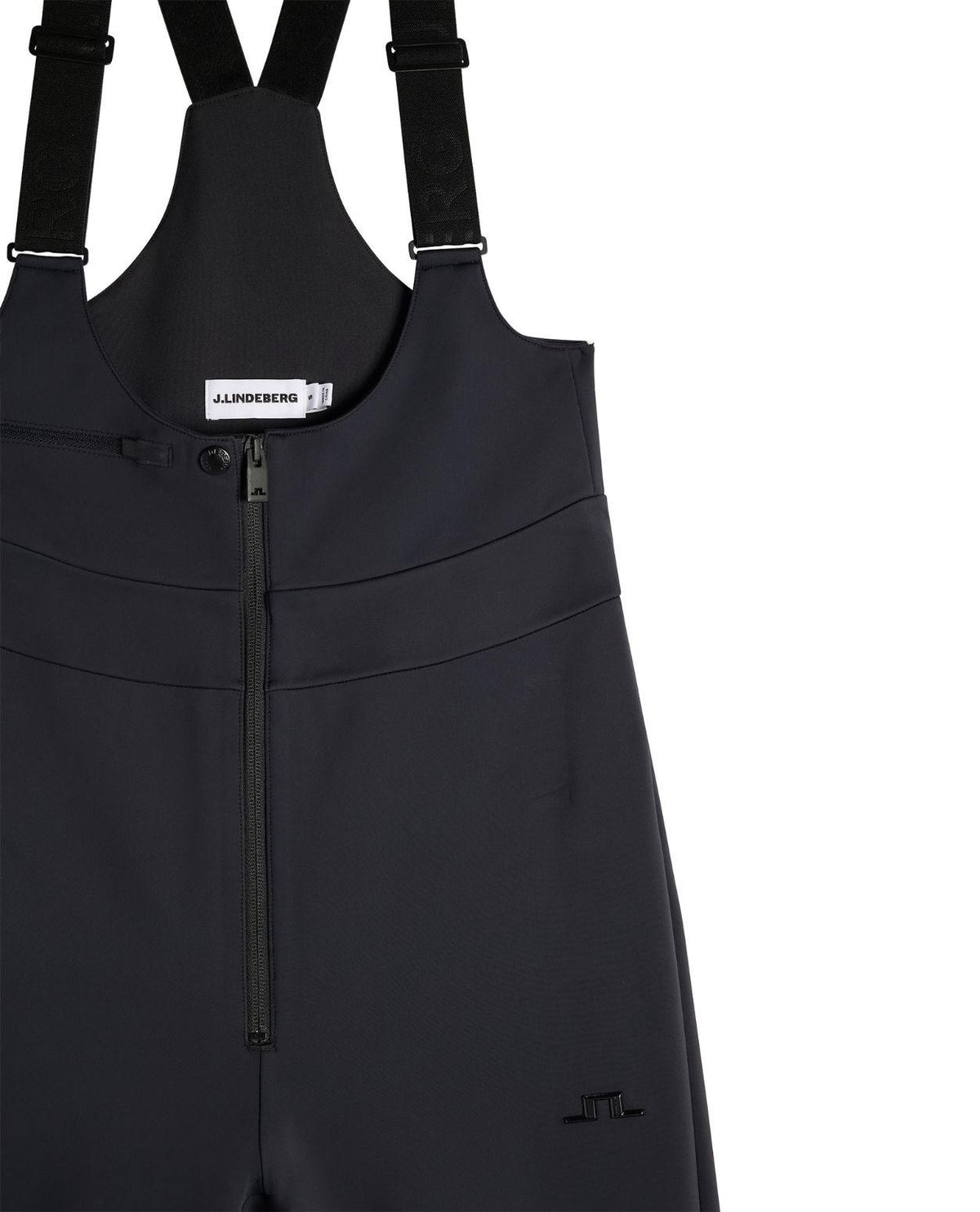 J.Lindeberg Aviana Softshell Bib Pant Women i svart, detaljbild på hängslen och dragkedja.