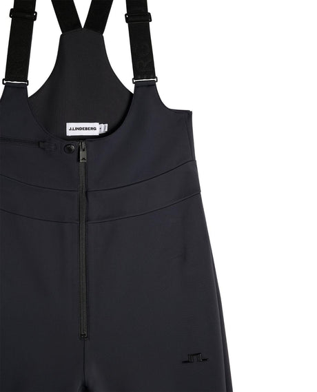 J.Lindeberg Aviana Softshell Bib Pant Women i svart, detaljbild på hängslen och dragkedja.