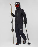 Mammut Eiger Free Pro HS Hooded Jacket Women i svart, visad på skidåkare med komplett utrustning